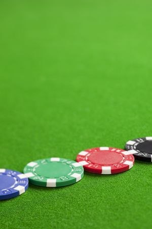 Blank casino chips on the green gaming tableの写真素材