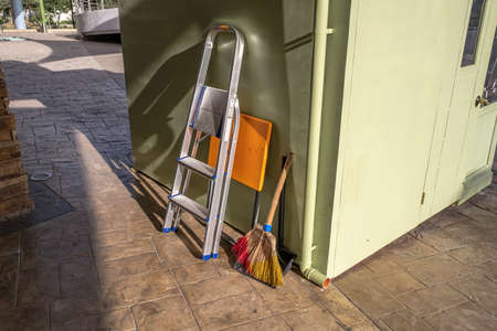 Cleaning supplies placed outside of a buildingの写真素材