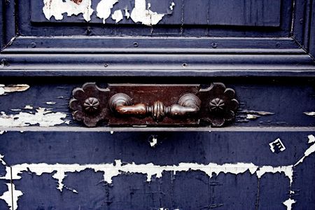 paint peeling on an old doorの写真素材