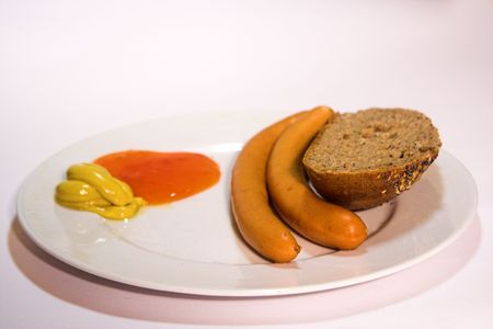 sausages, bread, ketchup and mustardの写真素材