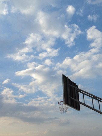 The basketball hoop outdoor with blue sky and cloud background.の写真素材