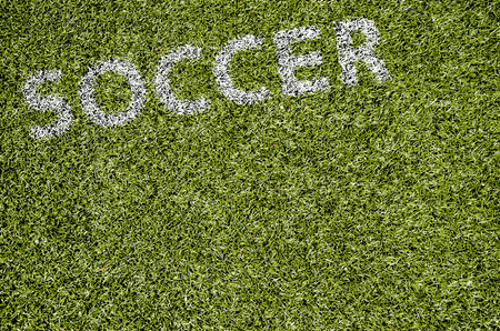 Texture of artificial turf and the word soccerの写真素材