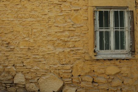 Yellow wall and old white windows good lookingの写真素材