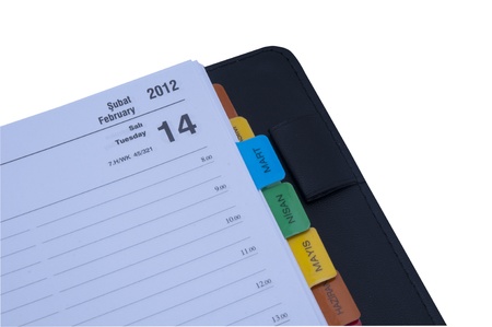 Personal organizer with pen, isolated on white.の写真素材