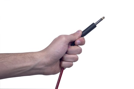 Human Hand Holding Audio Jack on isolated white background