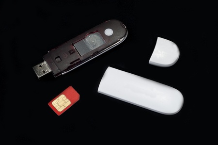 3g mobile moden and sim card  parts on isolated black background