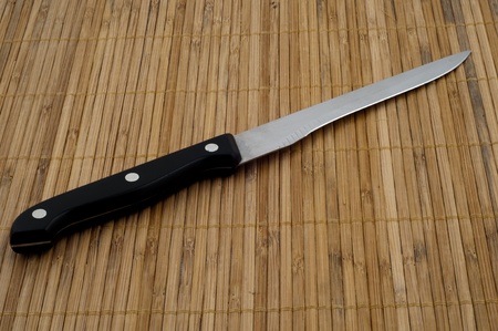 Sharpen Knife on wooden bamboo backgroundの写真素材
