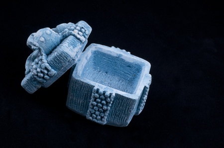 Closed porcelain gift box on black backgroundの写真素材