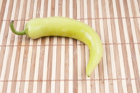 Green pepper on the bamboo backgroundの写真素材