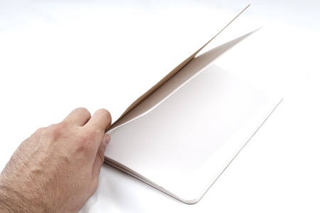 young guy holding scrapbook on white background