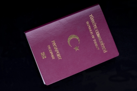 Touristic Turkish passport on the black backgroundの写真素材