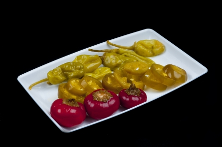 Mixed pepper pickles on the white plateの写真素材