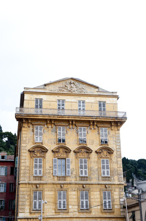 Old Yellow apartment building in Franceの写真素材
