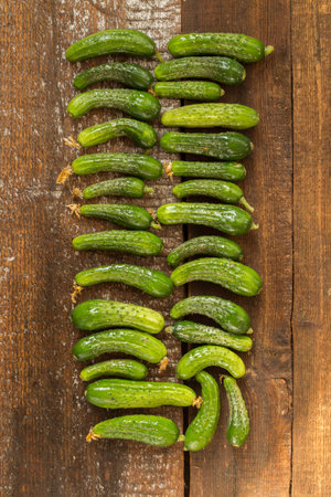 Cucumbers With Water Dots On The Wooden Backgroundの写真素材