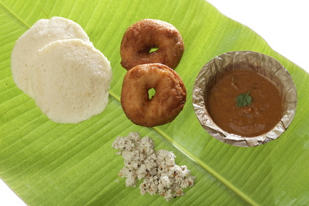 Indian fried snack medu vada  idli with coconut chutney and sambhar.の写真素材