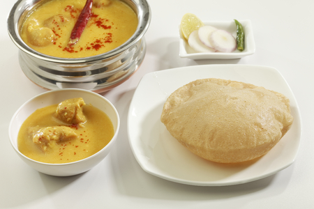 Indian Food: Kadhi with gatte and deep fried Puri.の写真素材