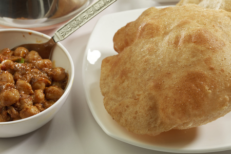 Indian Food: Chana Masala and deep fried Puri.の写真素材