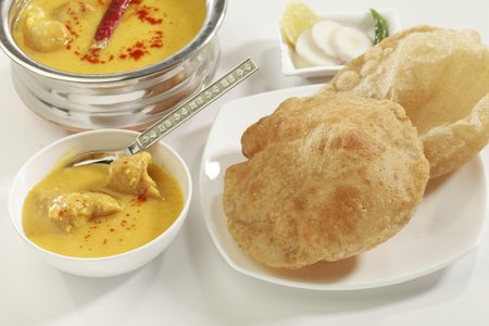 Indian Food: Kadhi with gatte and deep fried Puri.の写真素材