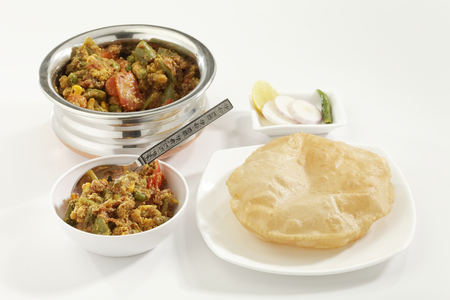 Indian dish Mixed vegetables along with Puri the fried Indian bread.の写真素材