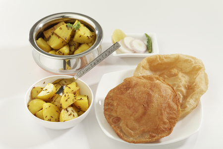 Indian dish fried potato with cumin along with Puri the fried Indian bread.の写真素材