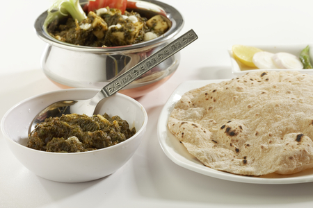 Indian vegetable food Spinach with cottage cheese with raw vegetables with chapati.の写真素材