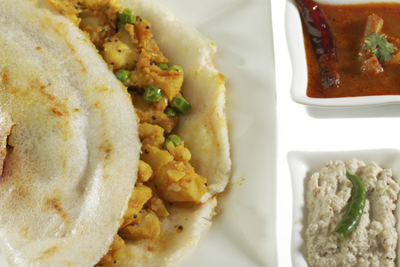 South Indian fast food Dosa Stuffed With Aloo Masala Chutney And Sambhar.の写真素材