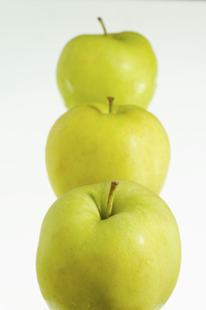 fresh green apples on a white background.の写真素材