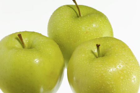 fresh green apples on a white background.の写真素材