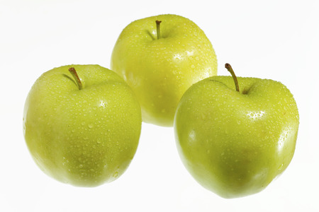 fresh green apples on a white background.の写真素材