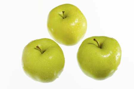fresh green apples on a white background.の写真素材