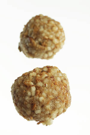 Fast food deep fried sago sabudana vada on white background.の写真素材