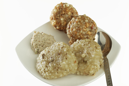 Fast food deep fried sago sabudana vada with chutney on white background.の写真素材
