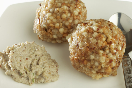 Fast food deep fried sago sabudana vada with chutney on white background.の写真素材