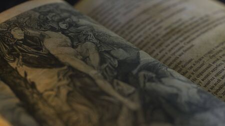 Detail of pages of an old book perseus with medusa head. An hand-drawn illustrations in ancient...