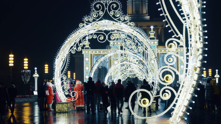Moscow, Russia - January 01 2021: VDNH exhibition complex in Moscow. Tourists walk by central alley of Russian Exhibition Complex at winter in snow-covered Moscow. New Year's holidayのeditorial素材