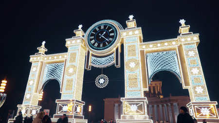 Moscow, Russia - January 01 2021: VDNH exhibition complex in Moscow. New Year's luminous decoration in the form of hours in a snowy park. Christmas magic decorのeditorial素材