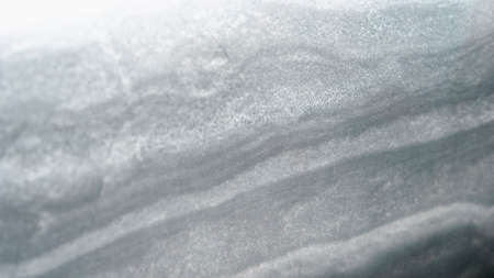 Arrangement of the layers in a snowdrift, snow texture, snowdrift texture. Compressed layers of snow...