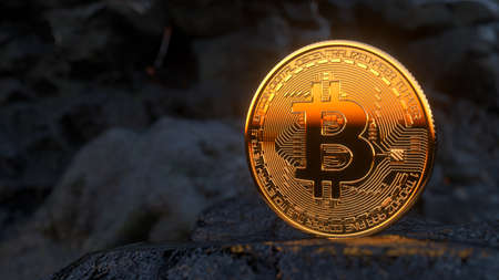 Golden bitcoin standing on stones on dark mountains background. Crypto currency blockchain. For background and commercial use. Virtual money concepts. Blockchain technology, bitcoin mining. 3d renderの写真素材