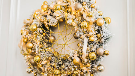 Bright New Year celebration dÃ©cor. Christmas and New Year interior in light classic style. White room with Xmas Tree decorated, flashing garland and gold balls. Winter Holiday Backgroundの写真素材