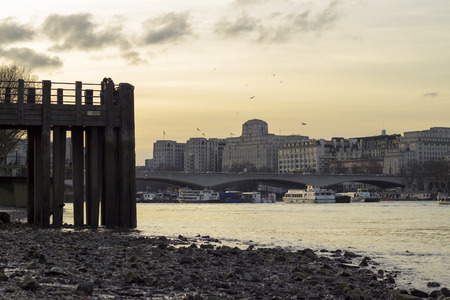 Wooden pier and Thames river in Londonのeditorial素材