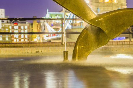 Fountain in front of Tower Bridge by night in Londonの写真素材
