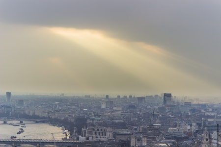 Aerial view of London with light coming from heavenの写真素材