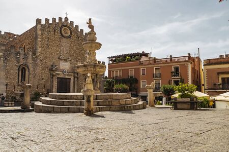 Taormina Sicily, Italy - July 9 2019: Architectural view of the fountain and basilica in Piazza Duomoのeditorial素材