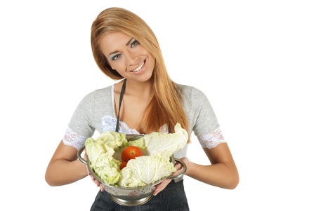 Happy young woman holding a pot of groceries の写真素材