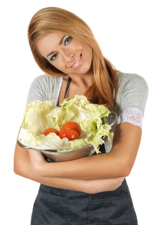 Happy young woman holding a pot of groceries の写真素材