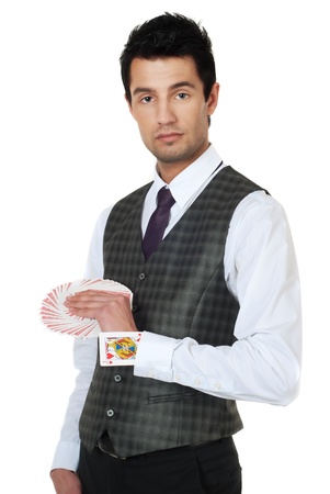 Young man magician holding cards in handsの写真素材