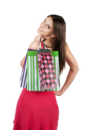 Young smiling woman carrying shopping bags.の写真素材