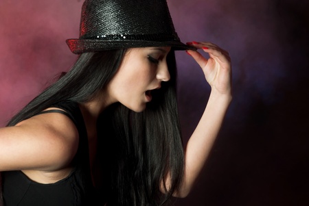 Beautiful singer over smokey backgroundの写真素材