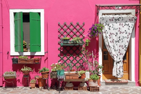 colorful front door to the house on venetian island Burano, Veneto, Italy, Europeの写真素材