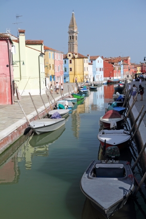 canal in Burano little village on Venetian lagoon ,vivid painted houses are typical for this wonderful italian borgo,Veneto, Europeのeditorial素材